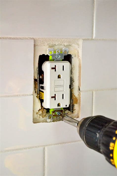 how to replace electrical box in a tiled wall|loose outlet after tiling.